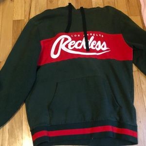 Young&Reckless green and red sweater, hood and strings,gives lil snug on sleeves